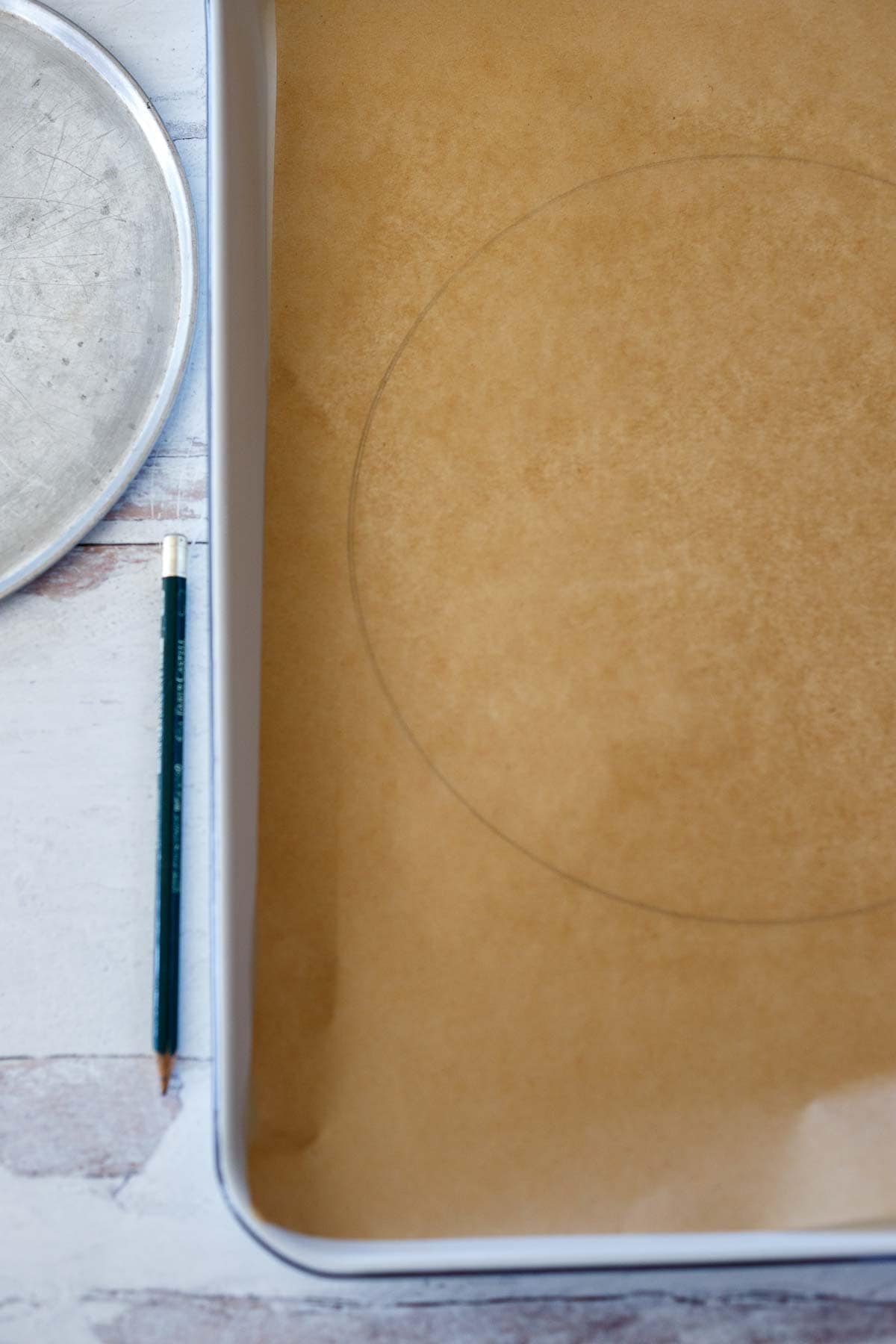 Drawing a template on parchment paper. 