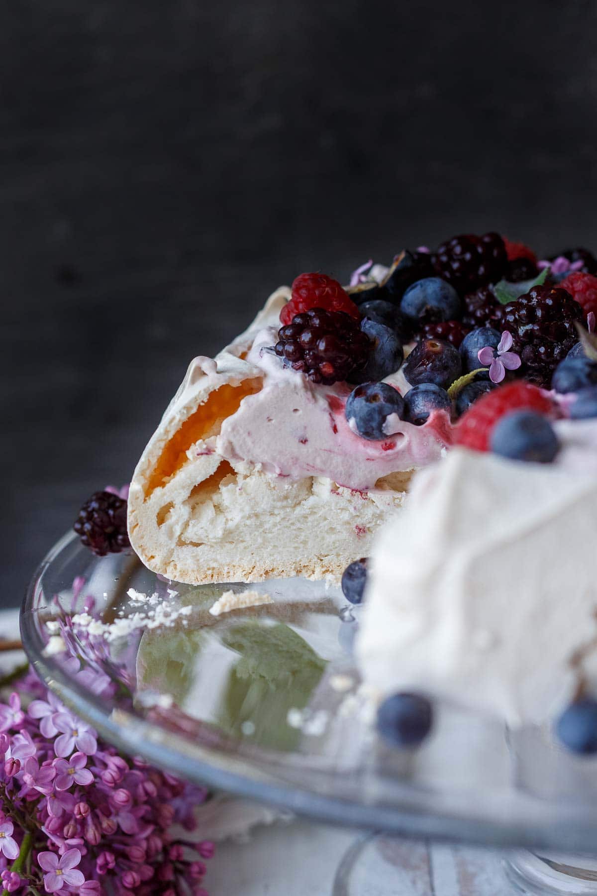 Pavlova with whipped cream and berries. 