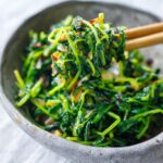 Wondering what to do with young pea shoots? These stir fried pea shoots are incredibly easy to make and full of flavor; a tasty spring side dish that comes together in 15 minutes!