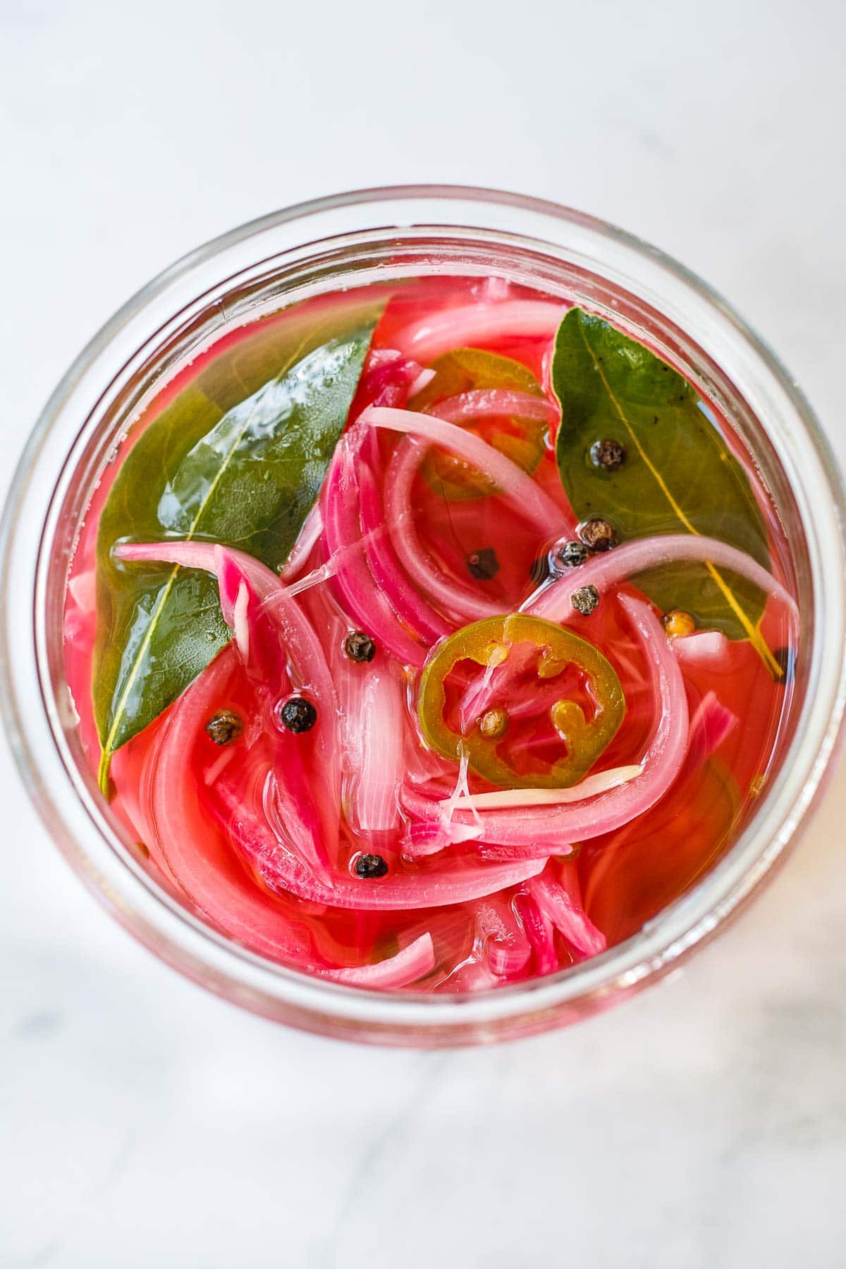 This Pickled Onions Recipe is the best!  Give your favorite meals a huge burst of flavor with these picked onions in just 15 minutes! They keep for up to 3 weeks in the fridge, but we doubt they will last that long! Video.
