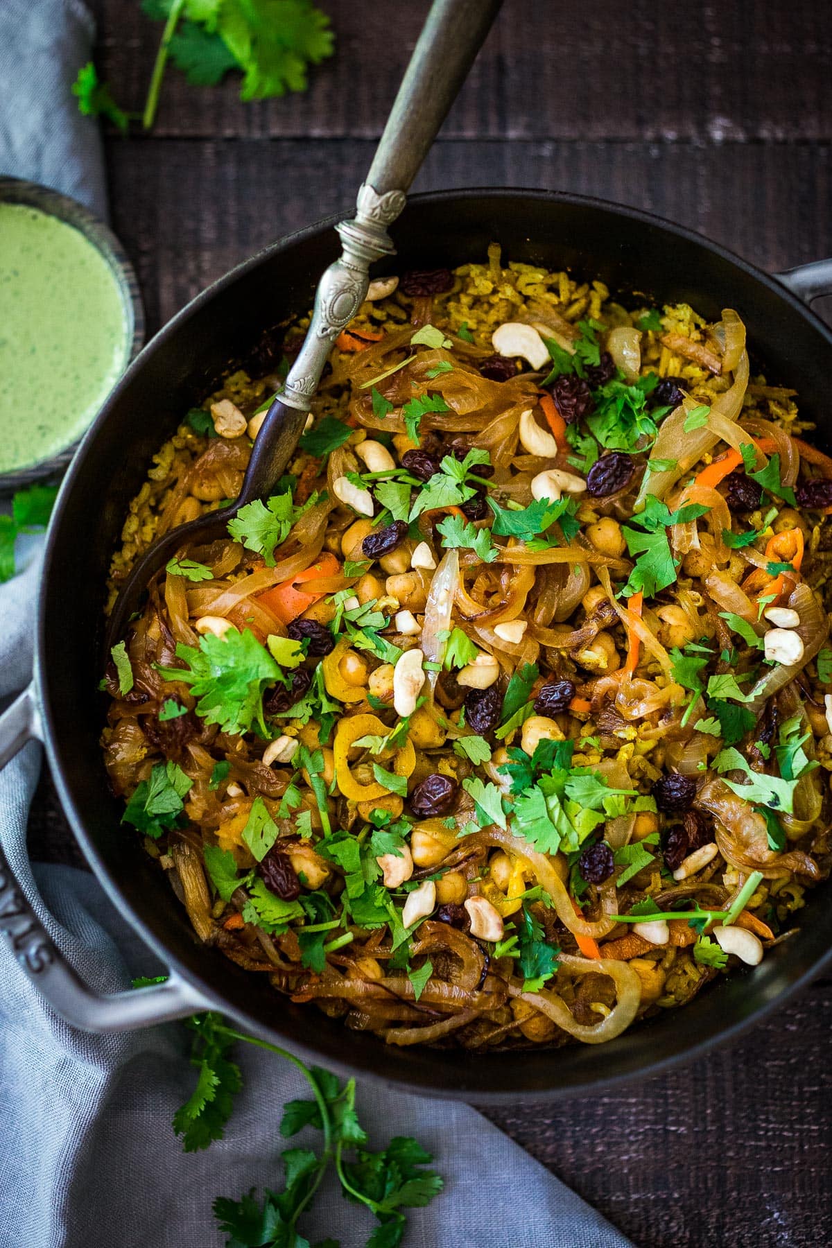 Delicious Vegetable Biryani! A fragrant Indian rice dish infused with Indian spices, healthy veggies and chickpeas.  Vegan adaptable and gluten-free. A quick and easy weeknight meal.