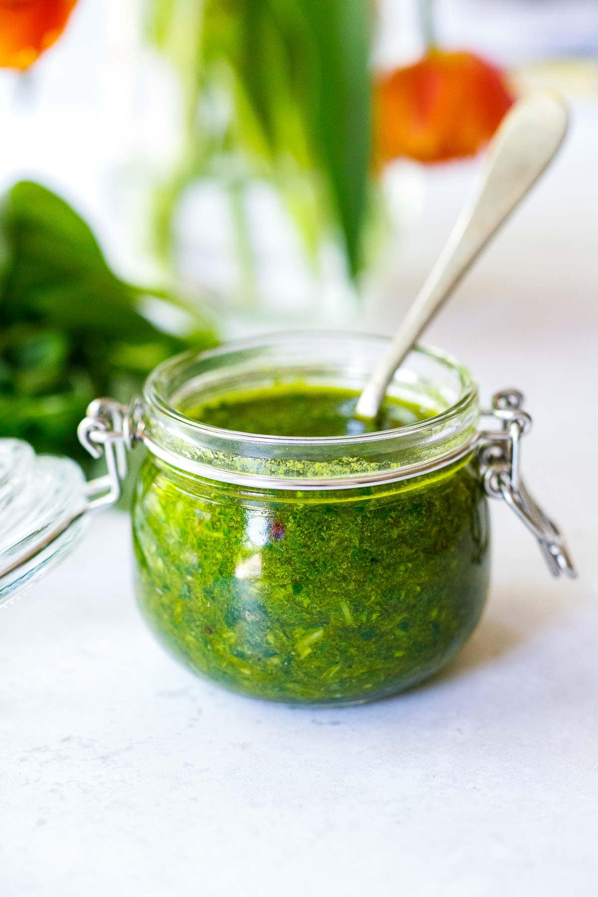 Basil Oil made with the simplest of ingredients; fresh basil, garlic, olive oil, lemon, salt, and pepper,  in just a few minutes, you'll have a flavorful condiment to elevate dishes you are already making. Vegan, nut-free, gluten-free. 