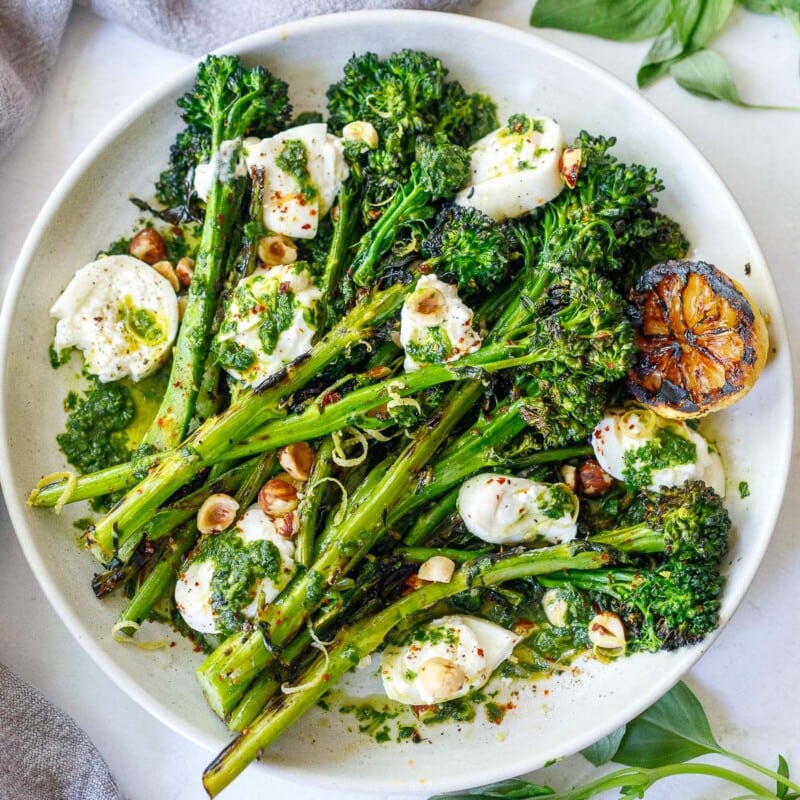 broccolini with burrata, hazelnuts and basil oil.