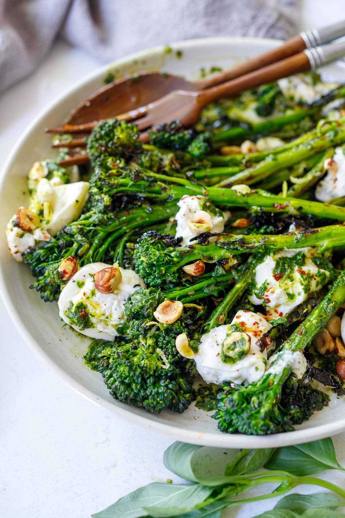 Grilled Broccolini with burrata cheese, toasted hazelnuts and basil oil- a tasty summer side dish perfect for outdoor dinners and gatherings.