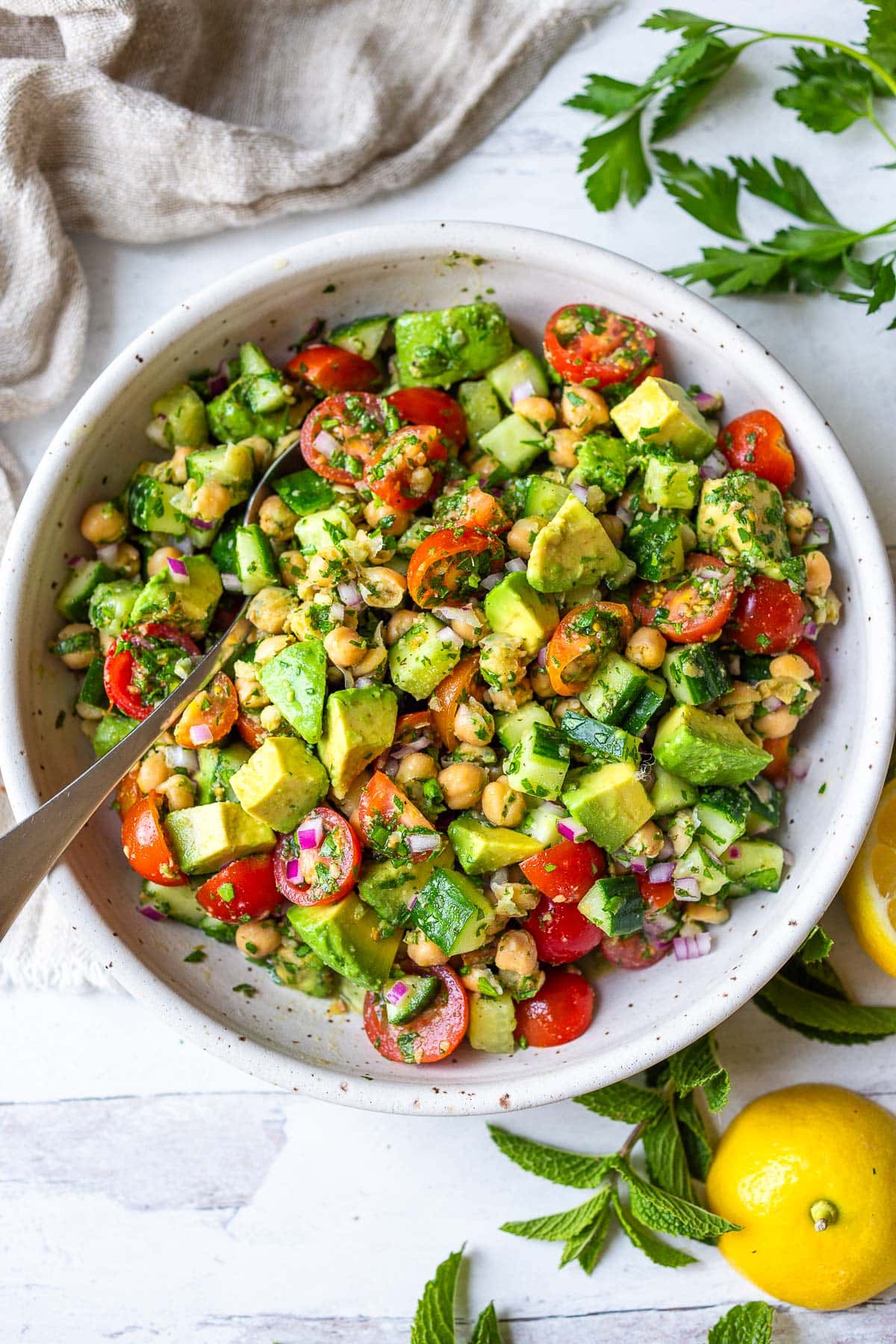 This Chickpea Salad is quick, easy and full of fresh flavors and crunchy texture. Made in one bowl with a simple lemon olive oil dressing, everything comes together in about 20 minutes! 