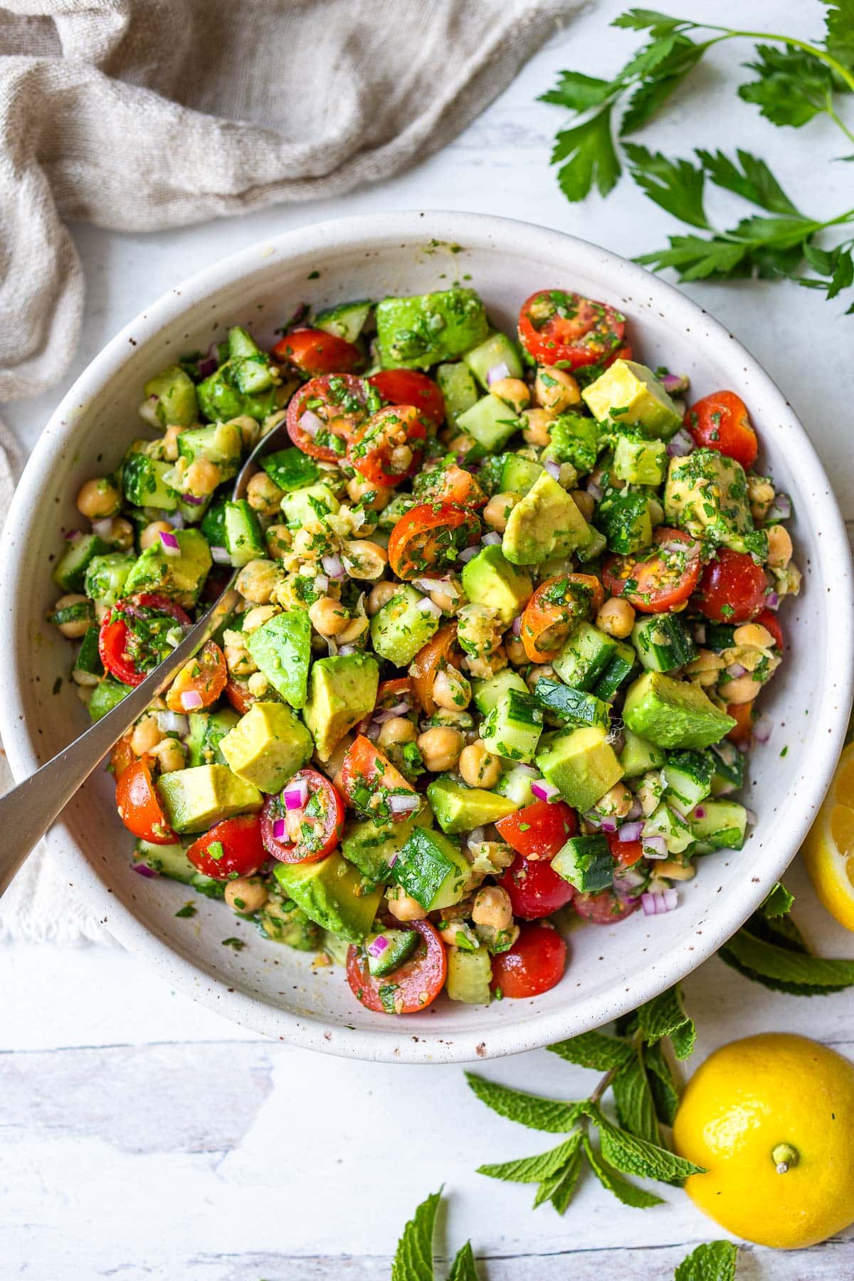 This Chickpea Salad is quick, easy and full of fresh flavors and crunchy texture. Made in one bowl with a simple lemon olive oil dressing, everything comes together in about 20 minutes!