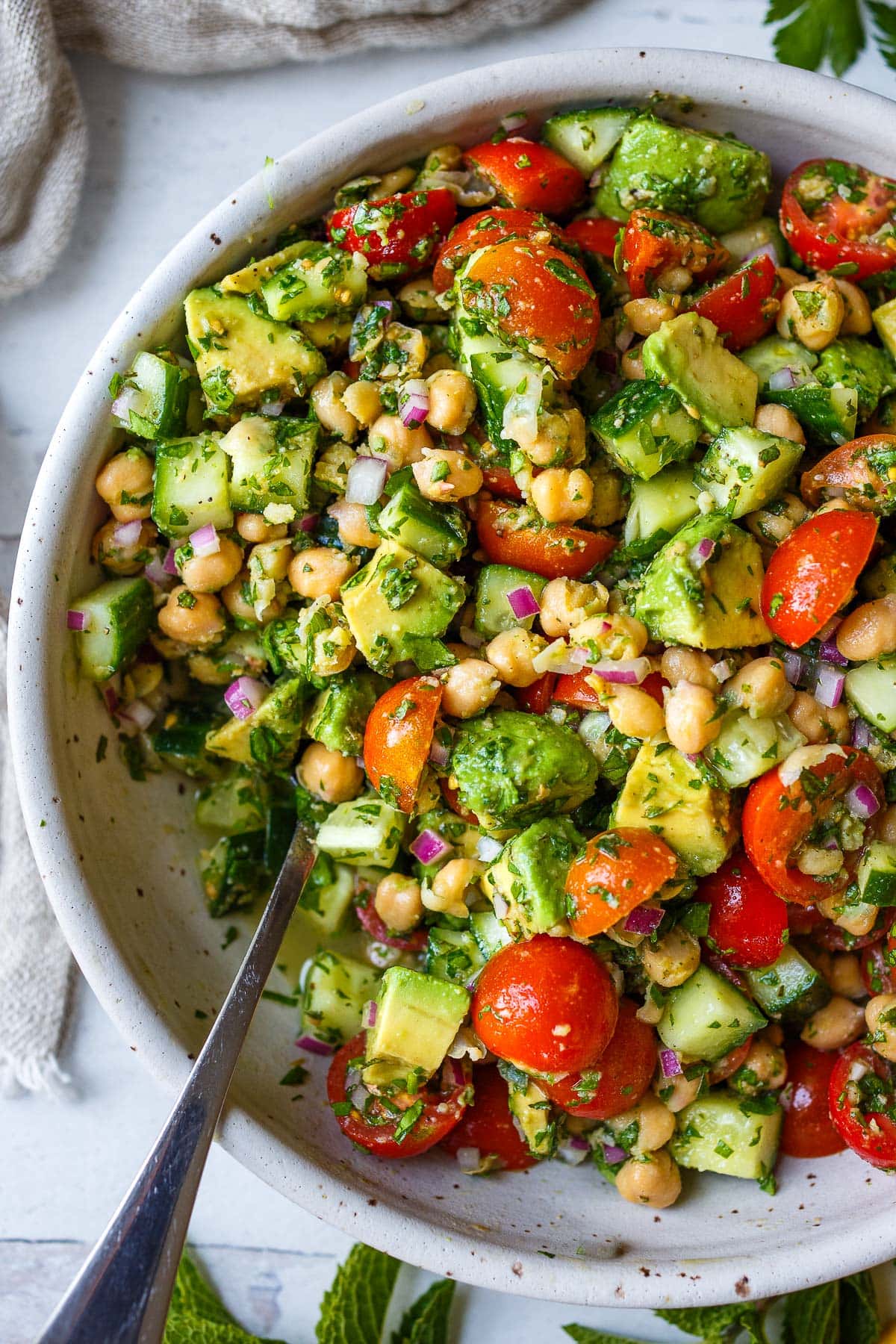 This Chickpea Salad is quick, easy and full of fresh flavors and crunchy texture. Made in one bowl with a simple lemon olive oil dressing, everything comes together in about 20 minutes!