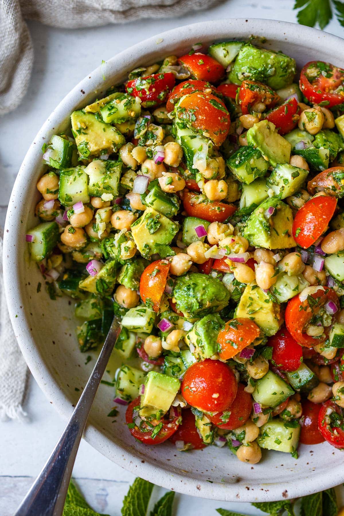 This Chickpea Salad is quick, easy and full of fresh flavors and crunchy texture. Made in one bowl with a simple lemon olive oil dressing, everything comes together in about 20 minutes! 