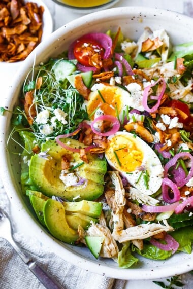 This Cobb Salad is the perfect meal for warm weather days. A light, fresh, and delicious protein-rich dinner with a tasty cobb salad dressing.