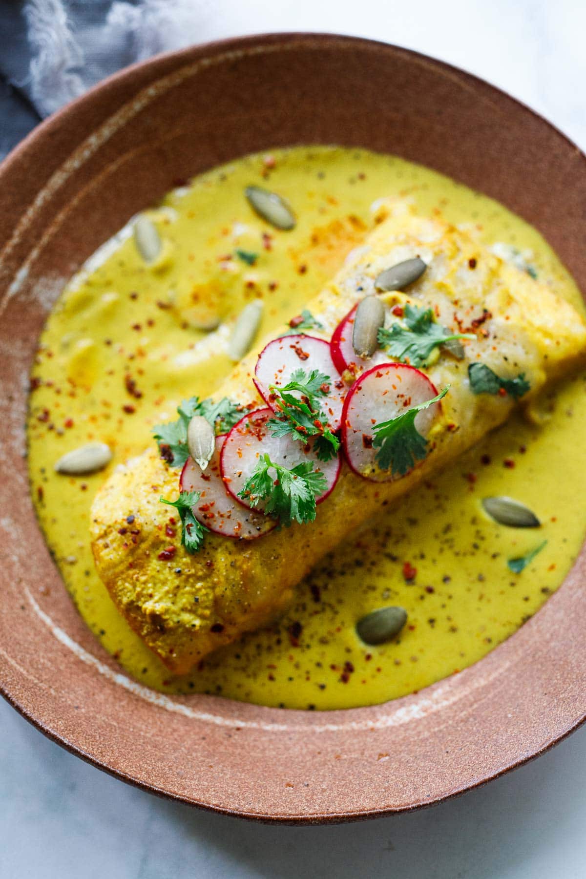 Shrimp Enchiladas with yellow Mole sauce.