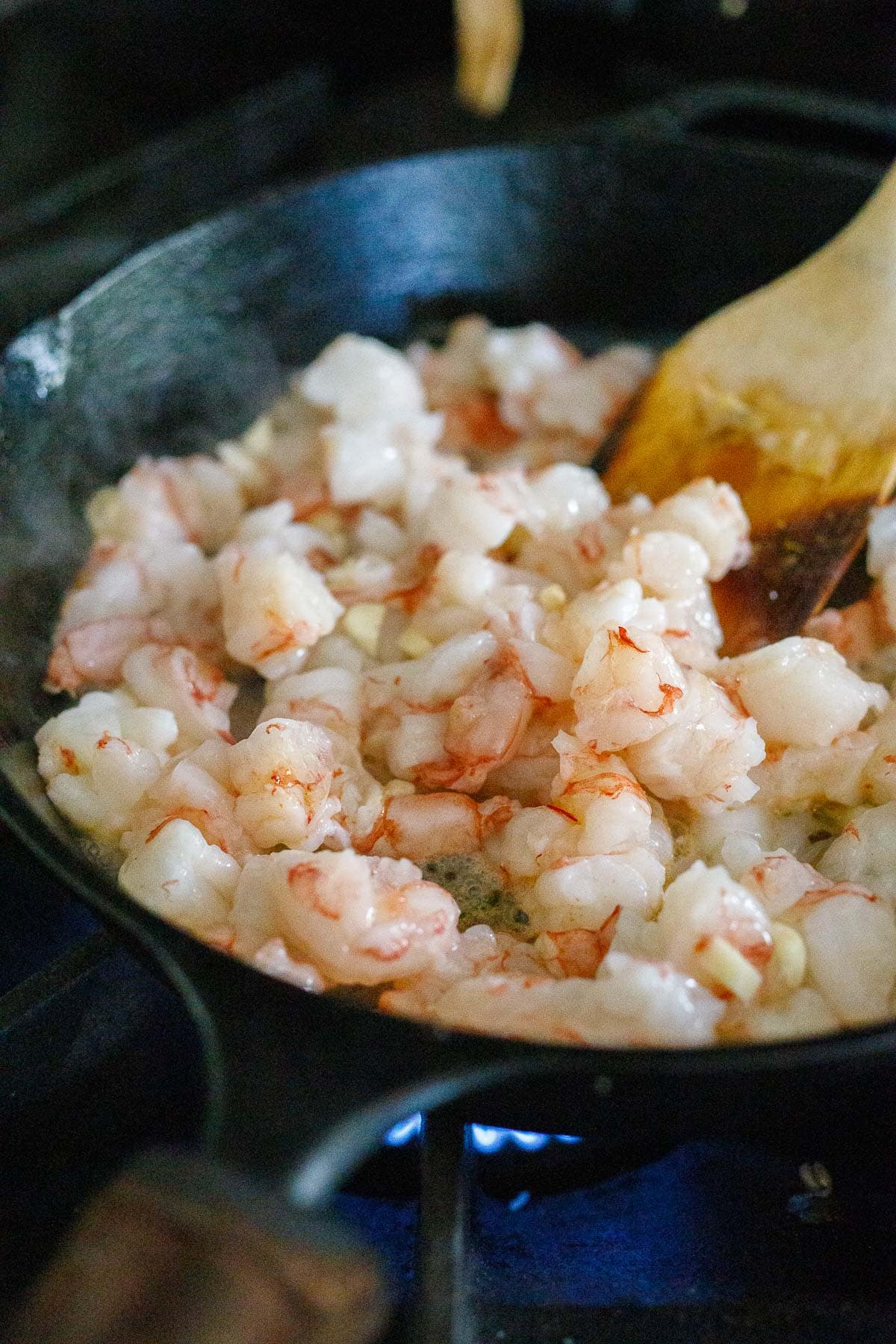 Sauteing the shrimp with garlic butter.