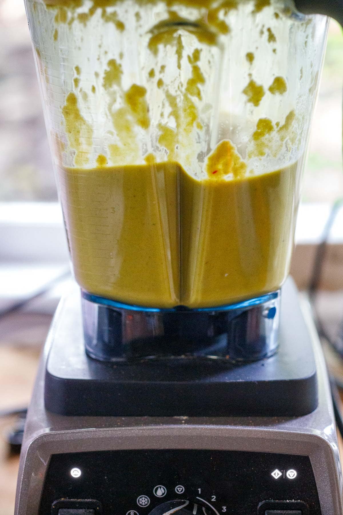 Yellow mole sauce in a blender.