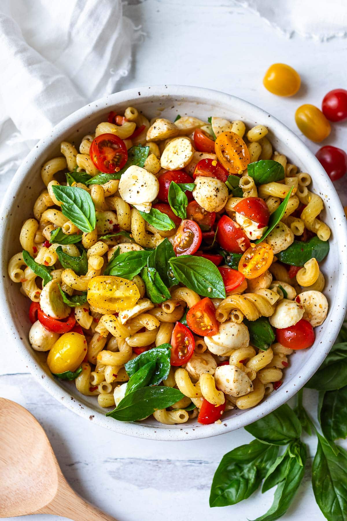 Caprese Pasta Salad in a white bowl.