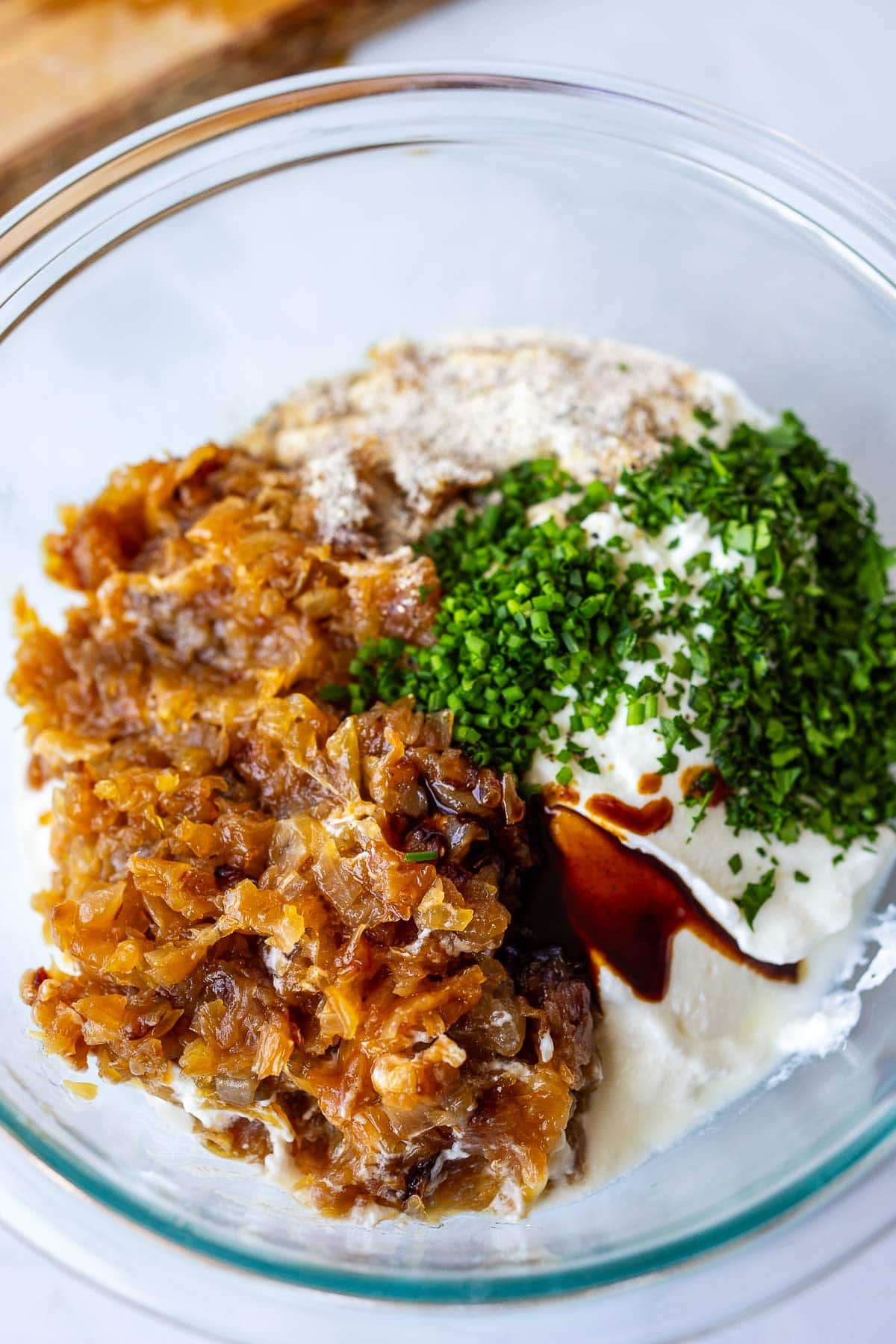 Mixing together French Onion Dip.