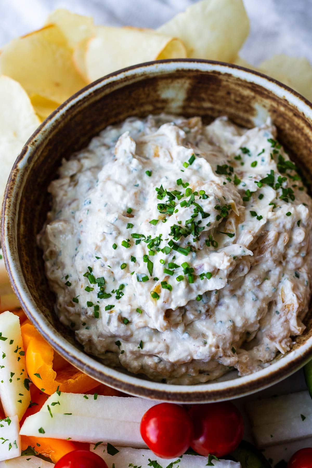 A delicious healthy take on French Onion Dip made with caramelized onions, creamy Greek yogurt, and fresh herbs. A perfect make ahead appetizer for potlucks and parties.