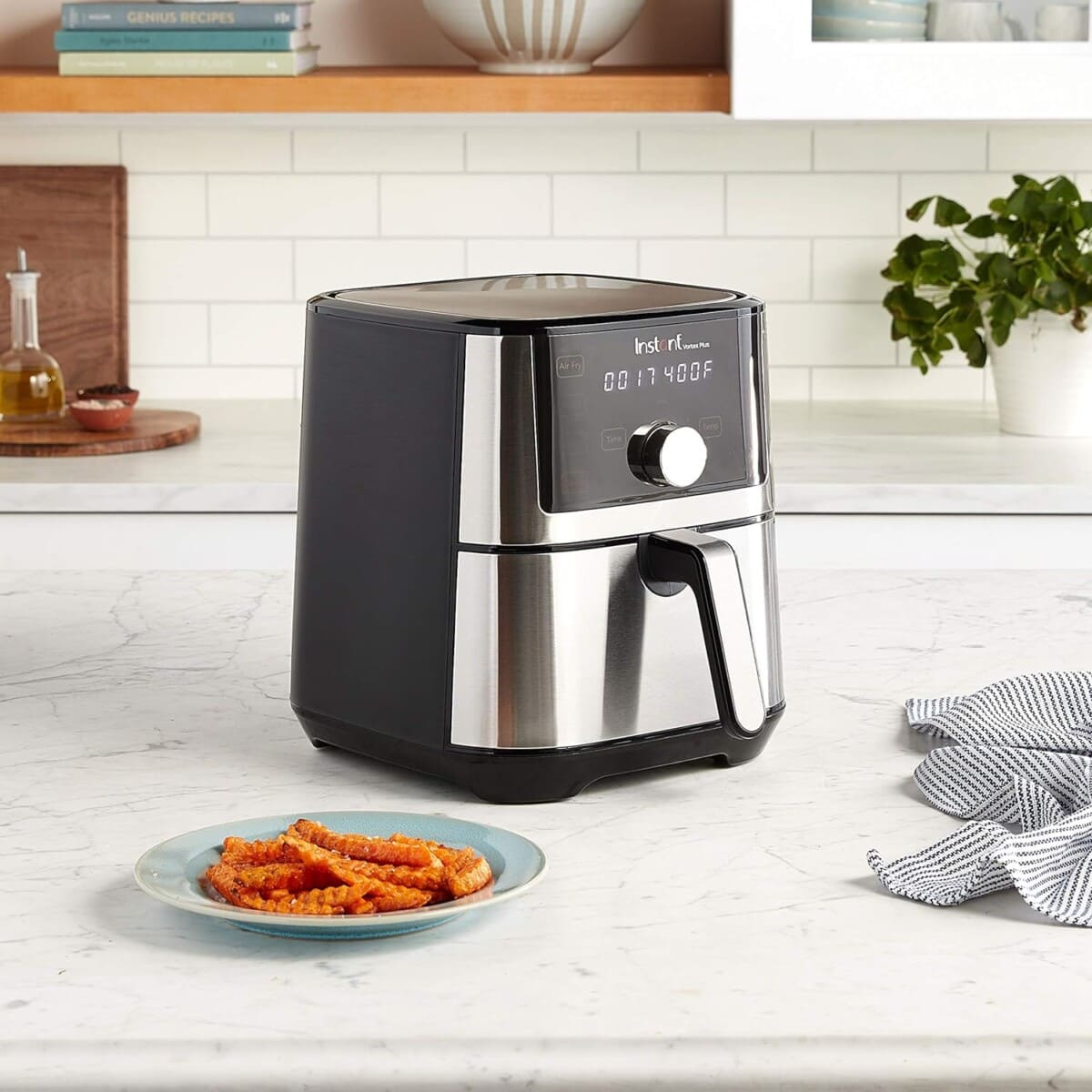 air fryer on the counter with sweet potato chips