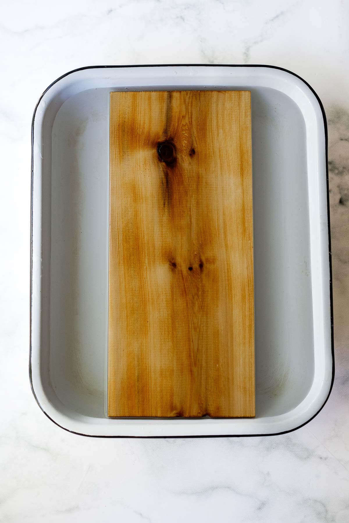 cedar plank soaking in water. 