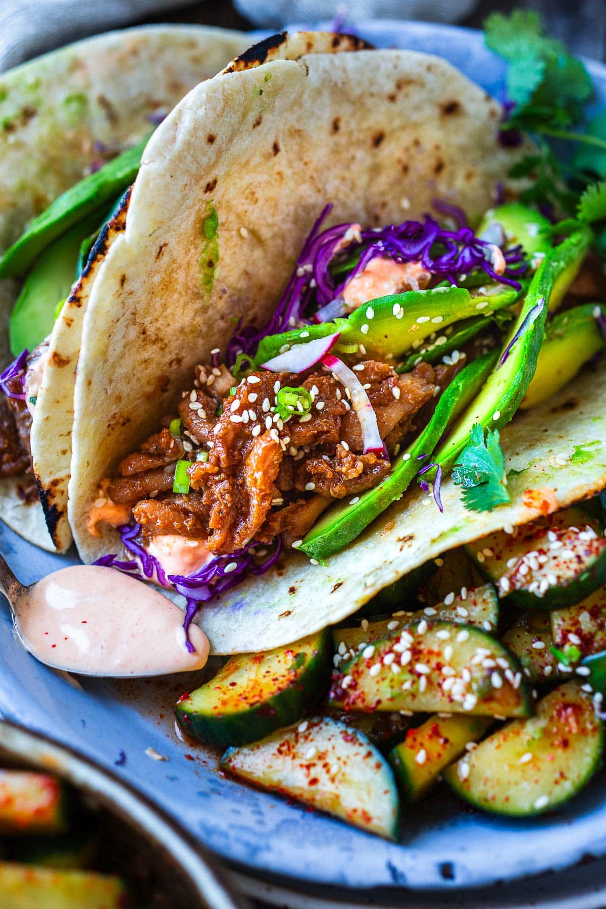 Take taco night to the next level!  Korean Tacos with chicken bulgogi are so incredibly flavorful-succulent, marinated chicken is sauteed until tender and topped with fresh avocado, cabbage, and a creamy gochujang taco sauce. 