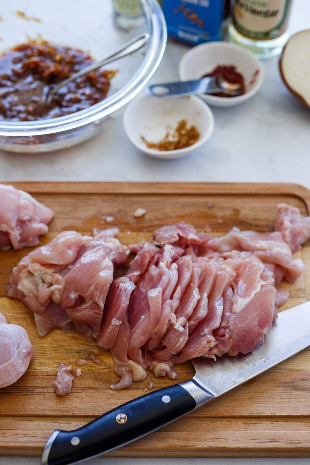 Slicing chicken for Korean Tacos.