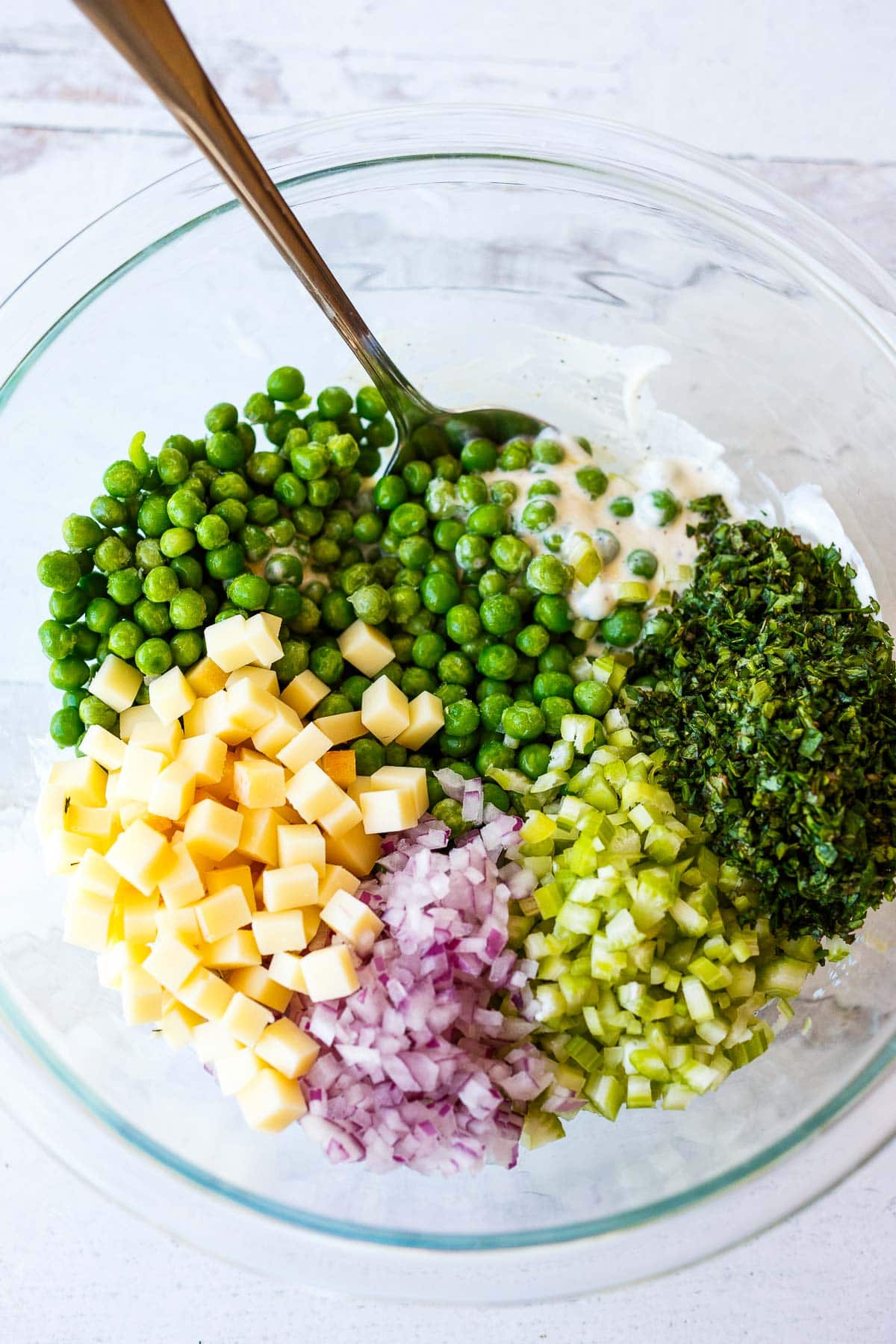 Mixing all ingredients in Pea Salad.