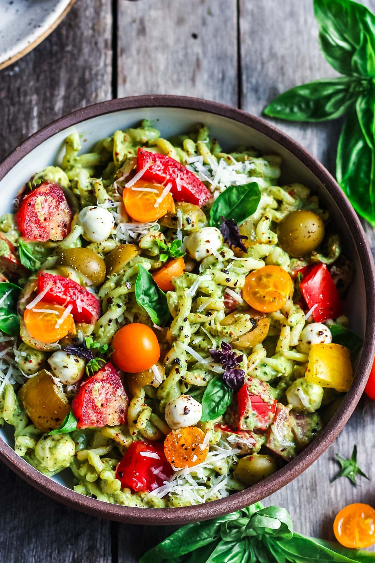 Pesto Pasta Salad w/ cherry tomatoes, baby mozzarella, olives & fresh basil tossed in a Creamy Pesto Dressing. Vegan, gluten-free adaptable. 