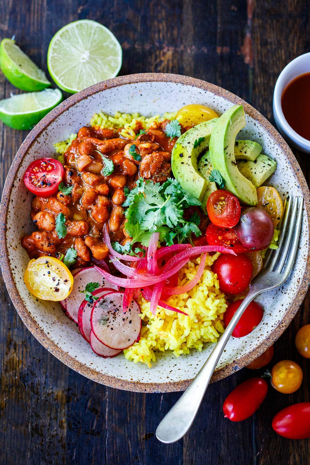 A quick and easy dinner idea, Baked Enchilada Beans are made with homemade, 5-minute enchilada sauce and Mexican cheese, baked in the oven until warm and melty. Turn them into burrito bowls for a delicious healthy dinner!