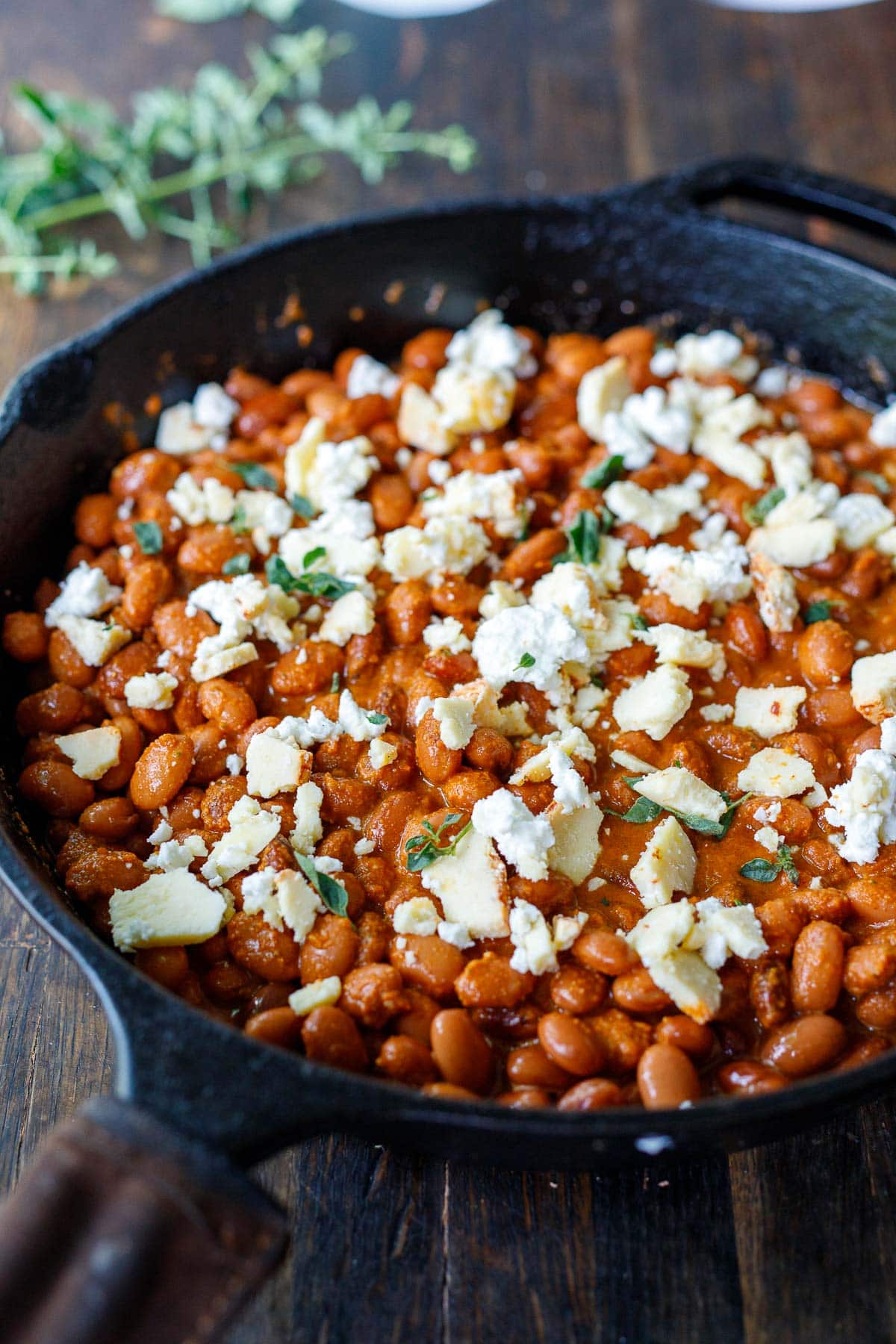 topping the beans with cheese. 
