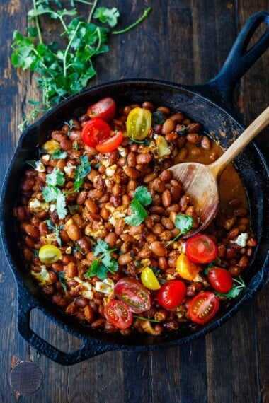 A quick and easy dinner idea, Baked Enchilada Beans are made with homemade, 5-minute enchilada sauce and Mexican cheese, baked in the oven until warm and melty. Turn them into burrito bowls for a delicious healthy dinner!