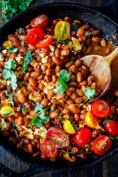 A twist on the classic Frijoles Rancheros- this version is made with pinto beans and homemade enchilada sauce, and crumbled queso fresco cheese, baked in the oven until melty. Vegan-adaptable. 