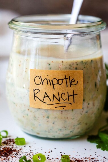 Creamy and smoky, homemade Chipotle Ranch Dressing takes things up a notch. With fresh lime juice, cilantro and just the right amount of chipotle pepper kick, this zesty dressing is also delicious as a dip or a spread! Vegan adaptable and gluten-free!