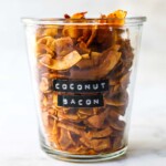 This Coconut Bacon recipe is healthy, crunchy and easy to make in about 15 minutes. A delicious savory, smoky topping for salads, soups, wraps and avocado toast! Vegan and Gluten Free!