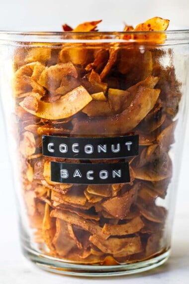 This Coconut Bacon recipe is healthy, crunchy and easy to make in about 15 minutes. A delicious savory, smoky topping for salads, soups, wraps and avocado toast! Vegan and Gluten Free!