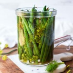 How to make Dilly Beans- a quick and easy recipe for pickled green beans that can be used in Bloody Marys, on charcuterie boards and cheese boards, or serve as a tasty snack. 