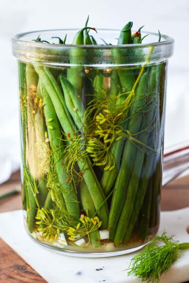 How to make Dilly Beans- a quick and easy recipe for pickled green beans that can be used in Bloody Marys, on charcuterie boards and cheese boards, or serve as a tasty snack. 