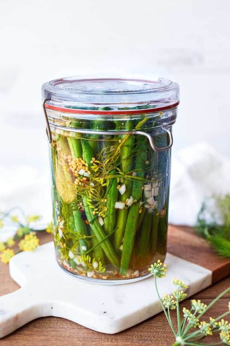 How to make Dilly Beans- a quick and easy recipe for pickled green beans that can be used in Bloody Marys, on charcuterie boards and cheese boards, or serve as a tasty snack. 