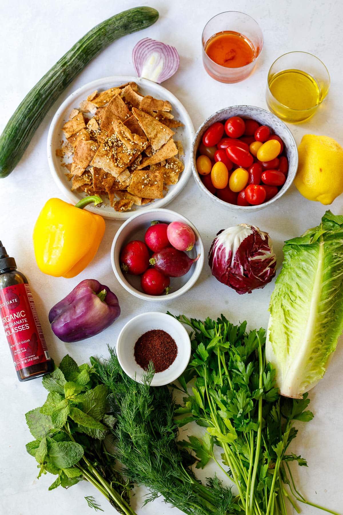 Fattoush Recipe ingredients on a white counter.