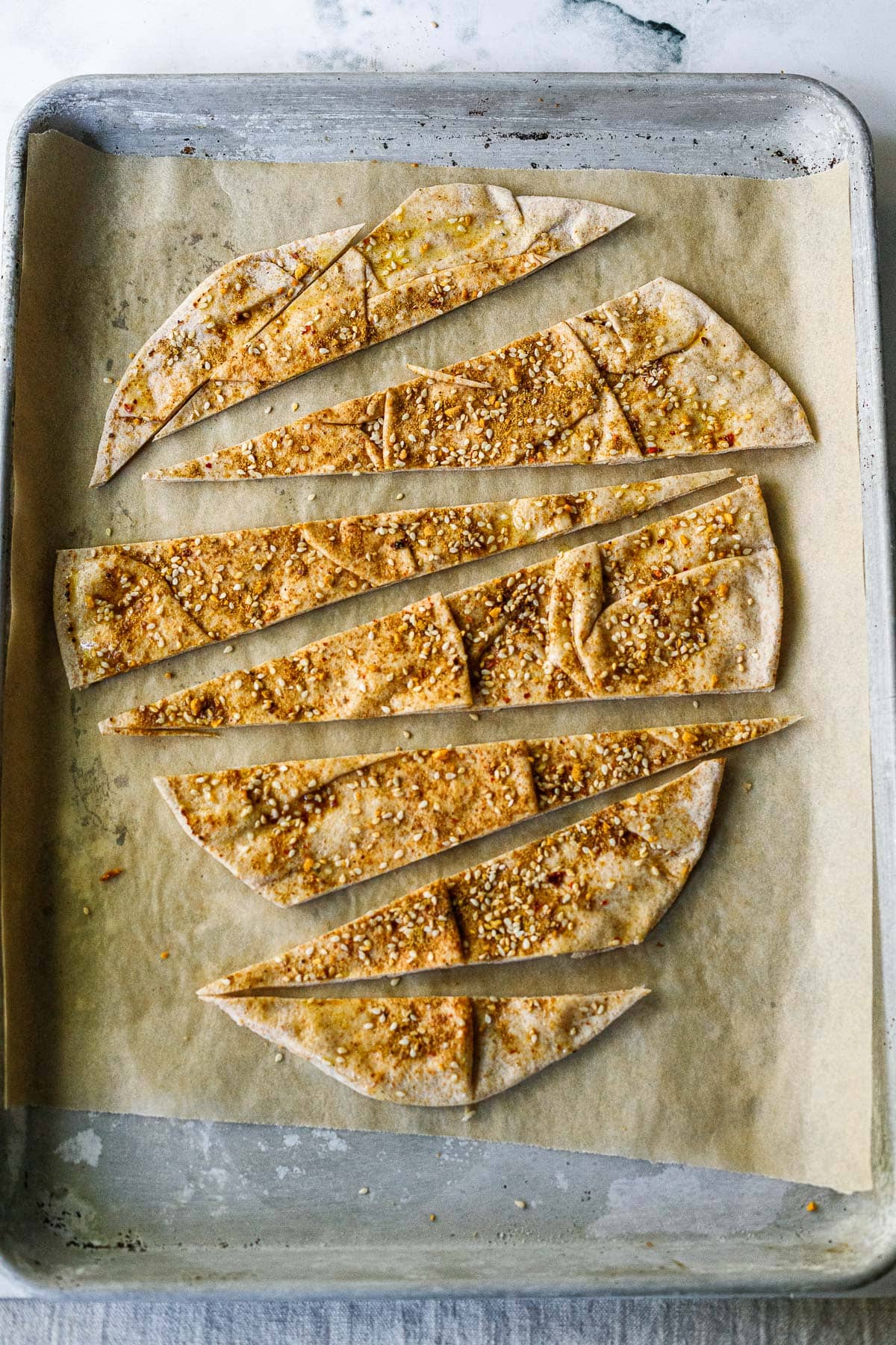 Making the toasted pita with zaatar.