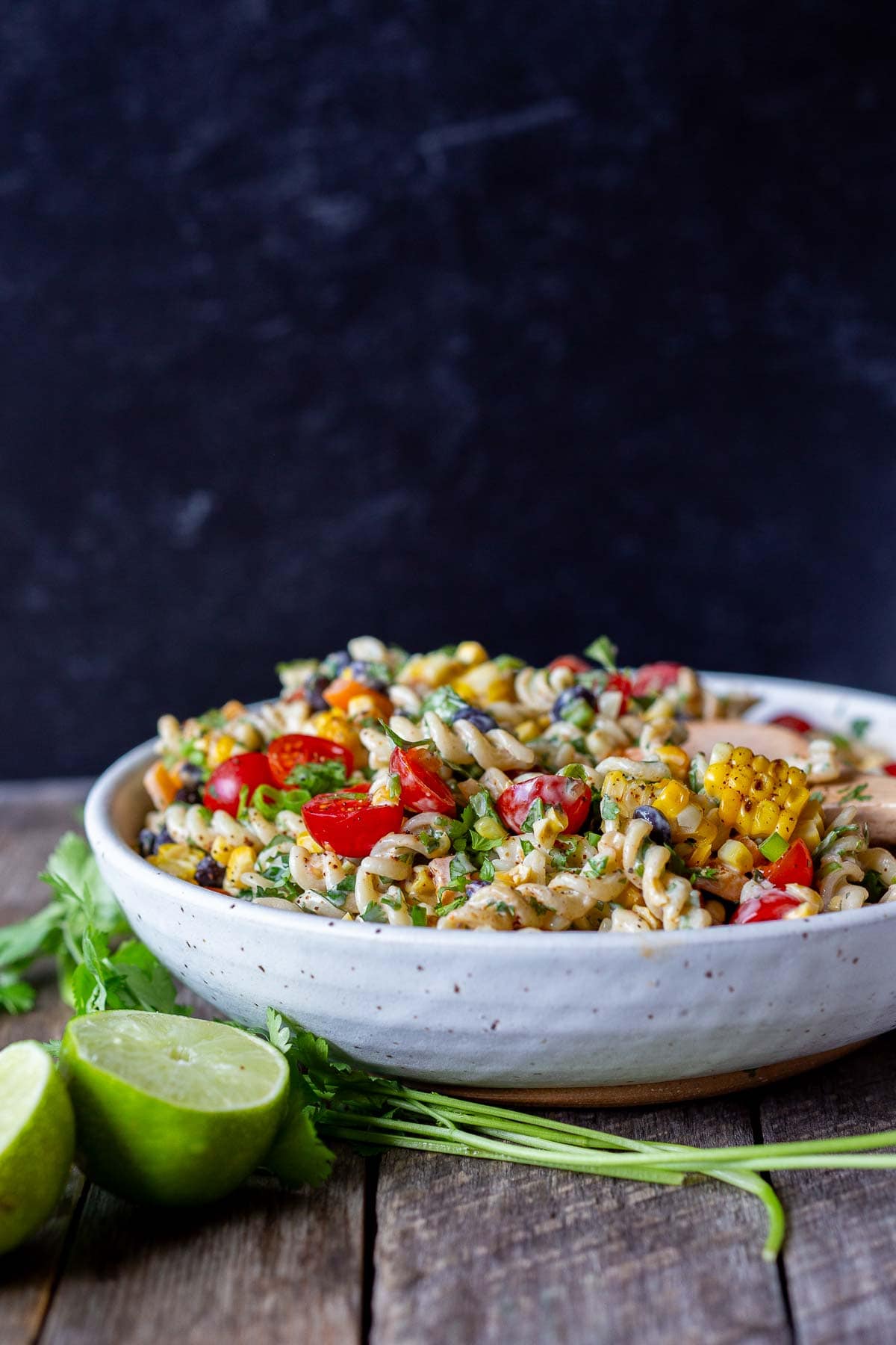 Southwest Pasta Salad is so satisfying, with just the right amount of zesty kick. Tender pasta, crunchy fresh veggies, and black beans dressed with a delicious Chipotle Ranch Dressing—the perfect side dish for potlucks, cookouts, and BBQs. 