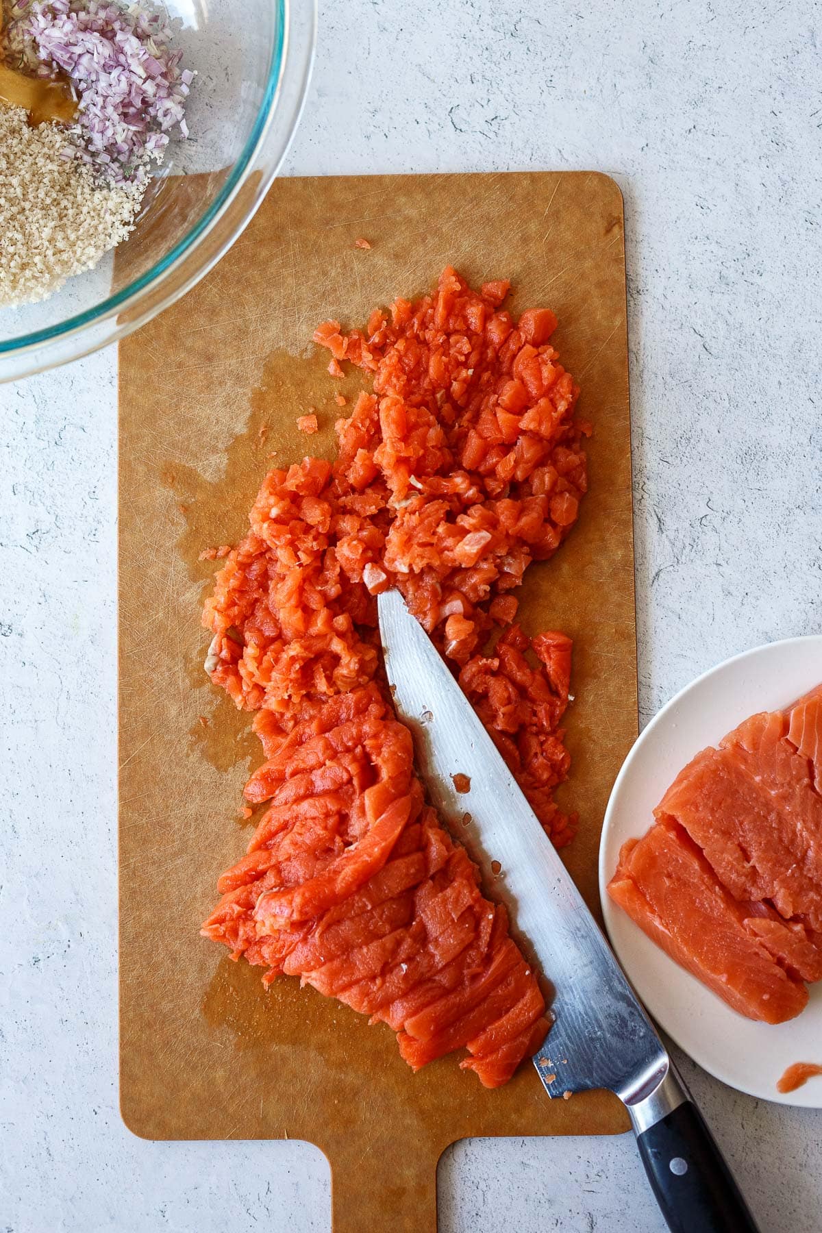 Chopping salmon for salmon burgers.