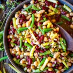 This classic Three Bean Salad recipe is full of tangy flavor, fiber and lots of plant protein! An easy make-ahead side dish for picnics, potlucks, and BBQs. Vegan and Gluten-Free.