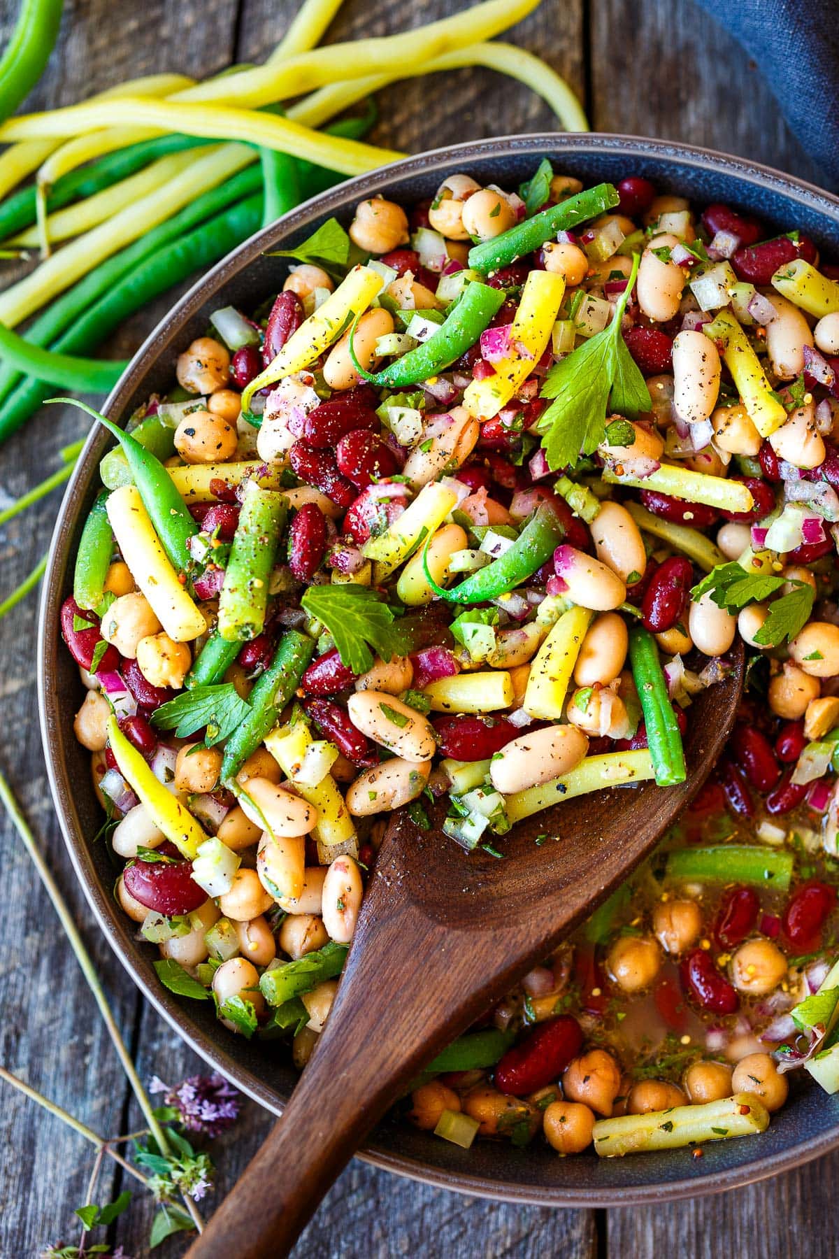 This classic Three Bean Salad recipe is full of tangy flavor, fiber and lots of plant protein! An easy make-ahead side dish for picnics, potlucks, and BBQs. Vegan and Gluten-Free.