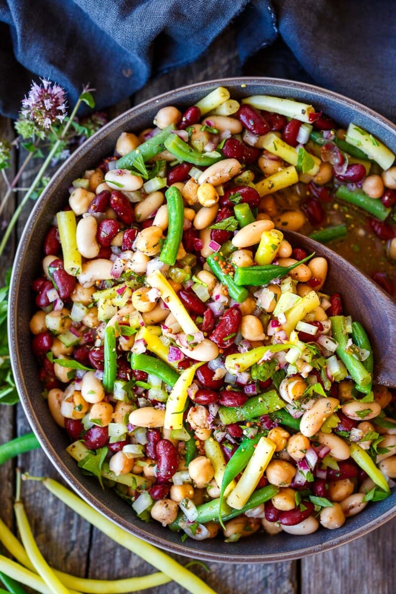 This classic Three Bean Salad recipe is full of tangy flavor, fiber and lots of plant protein! An easy make-ahead side dish for picnics, potlucks, and BBQs. Vegan and Gluten-Free.
