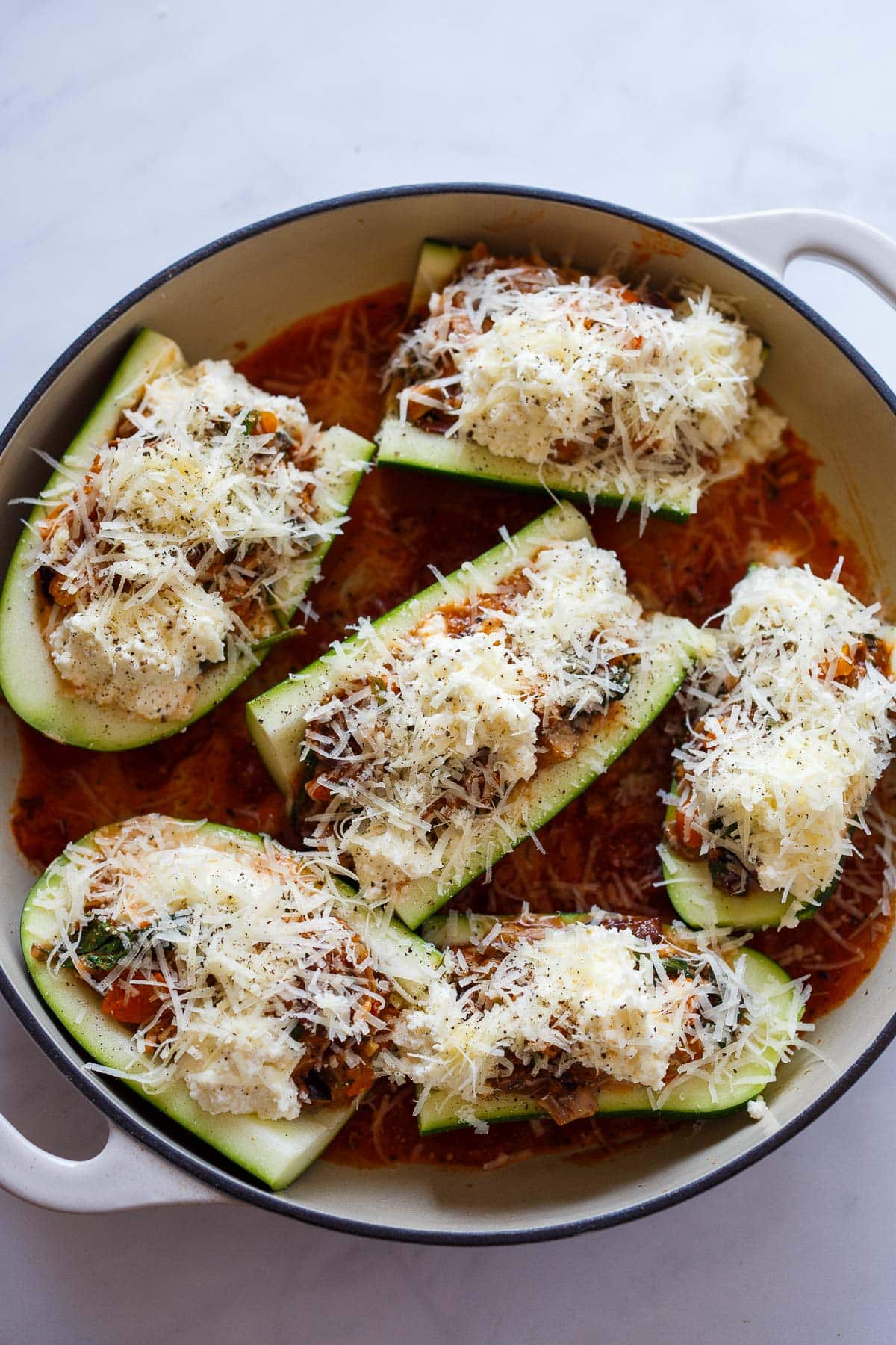 Stuffed zucchini in a pan, unbaked.