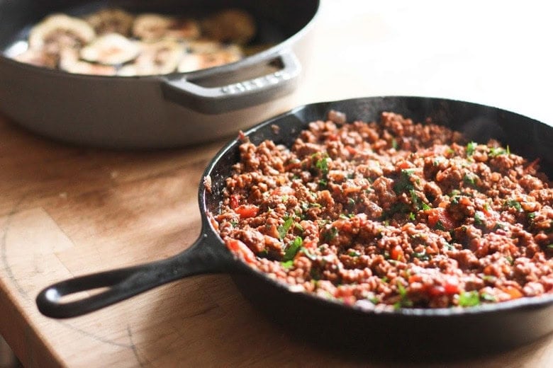 cast iron skillet with tomato meat sauce.