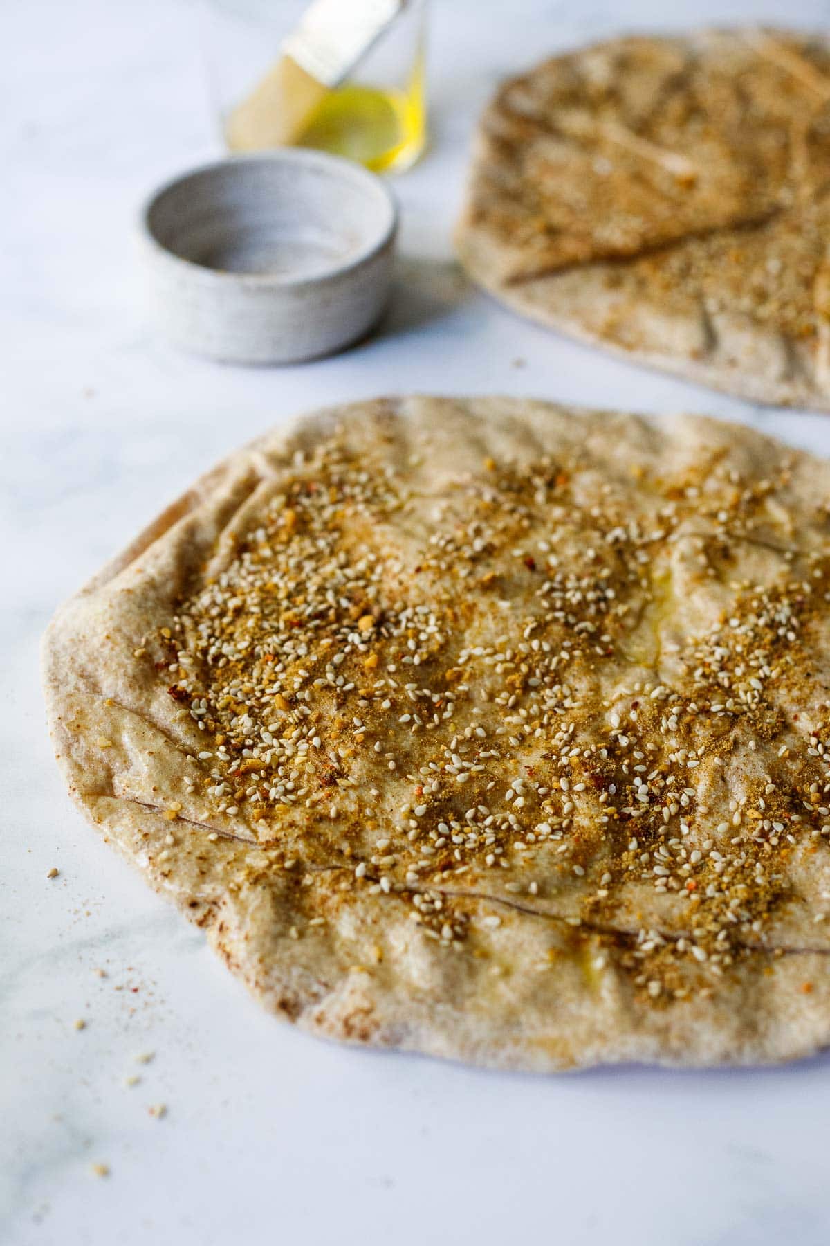 pita bread round with spices and sesame seeds