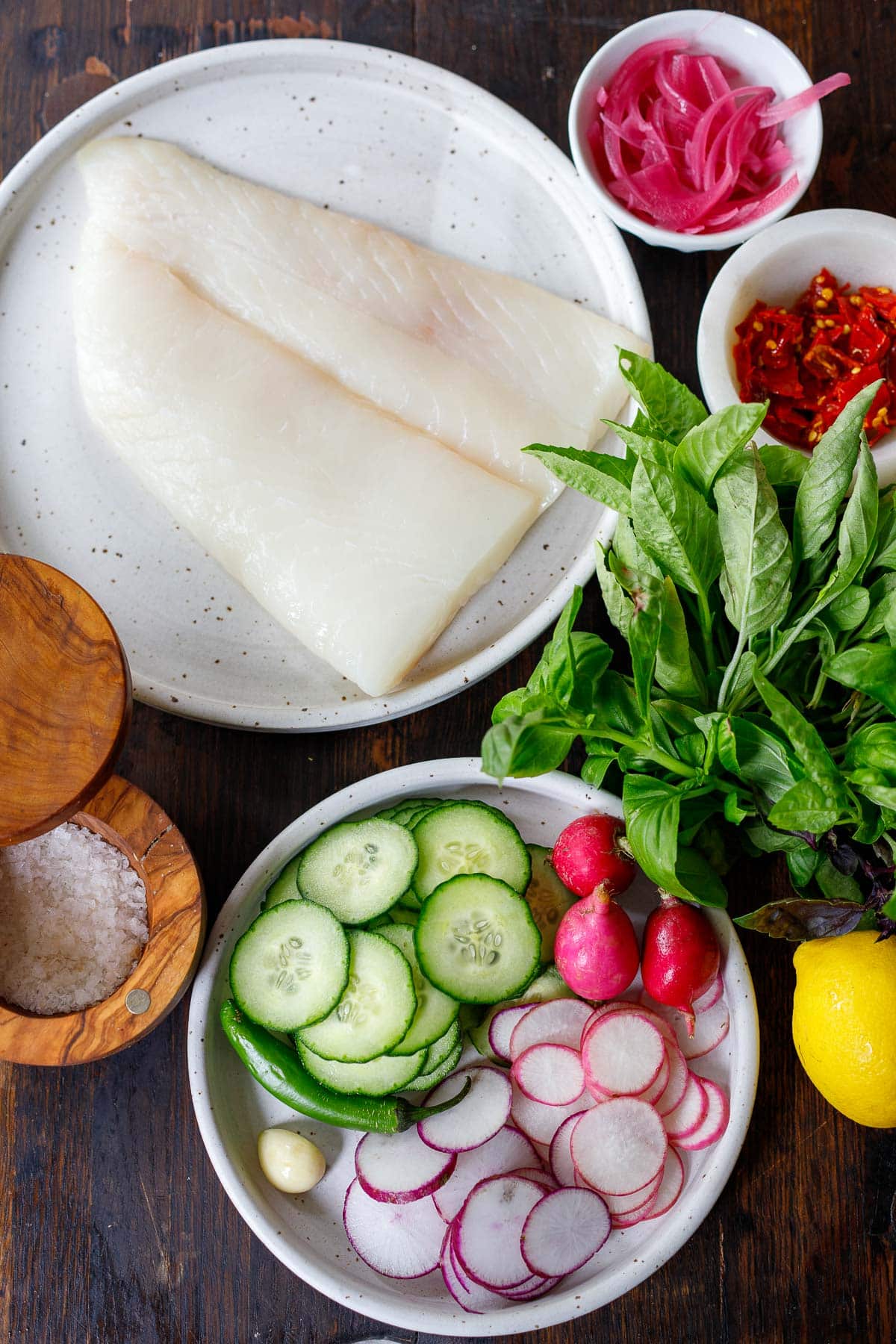 Crudo Ingredients: raw fish, fresh vegetables and herbs arranged to make crudo.