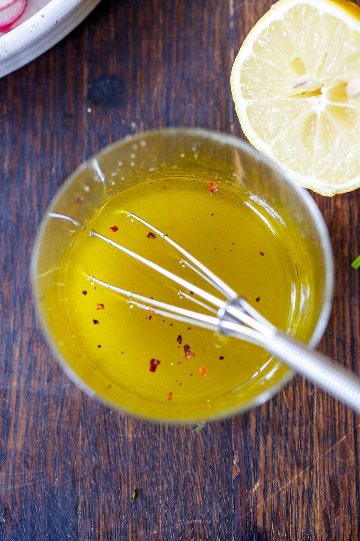 whisk in a jar of oil and citrus dressing with red pepper flakes.