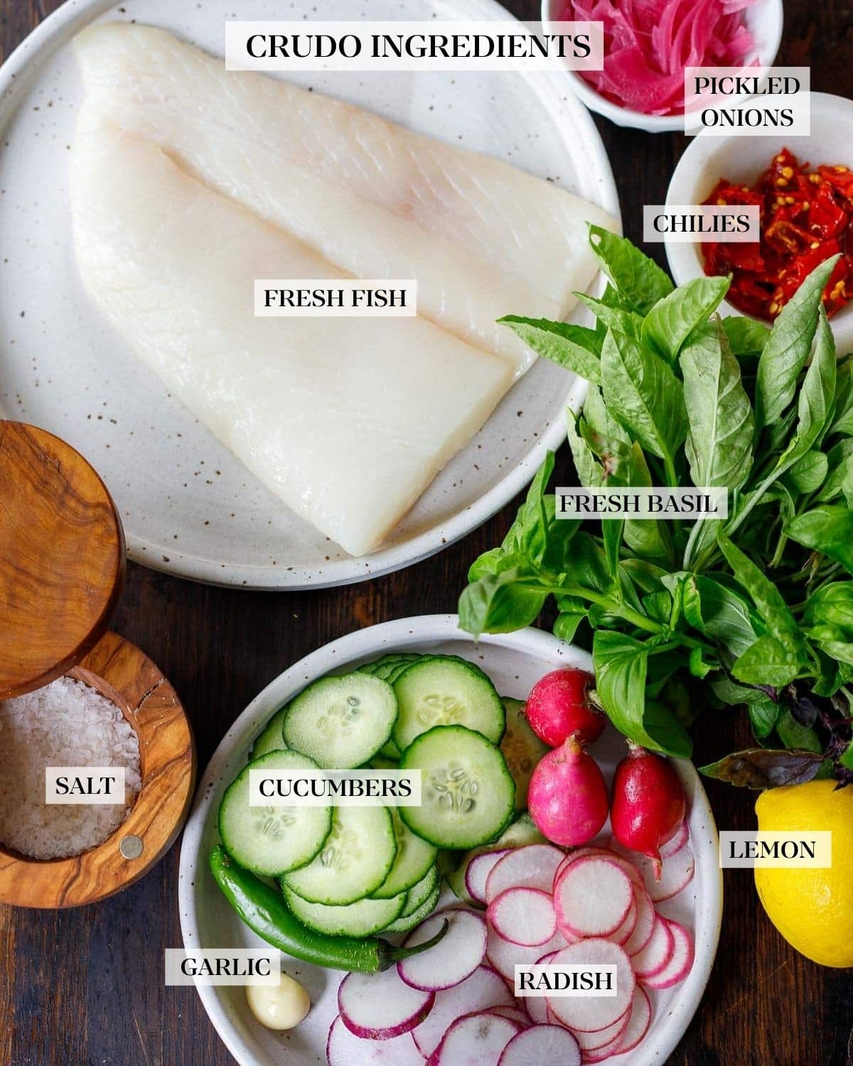 Crudo Ingredients: raw fish, fresh vegetables and herbs arranged to make crudo.