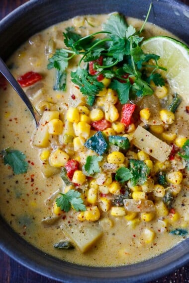 Heart-warming Poblano Corn Chowder is creamy, vegan and full of summertime flavor. Corn, potatoes, and poblano peppers with Mexican spices, in a creamy vegan base. Easy to make and deliciously addicting.