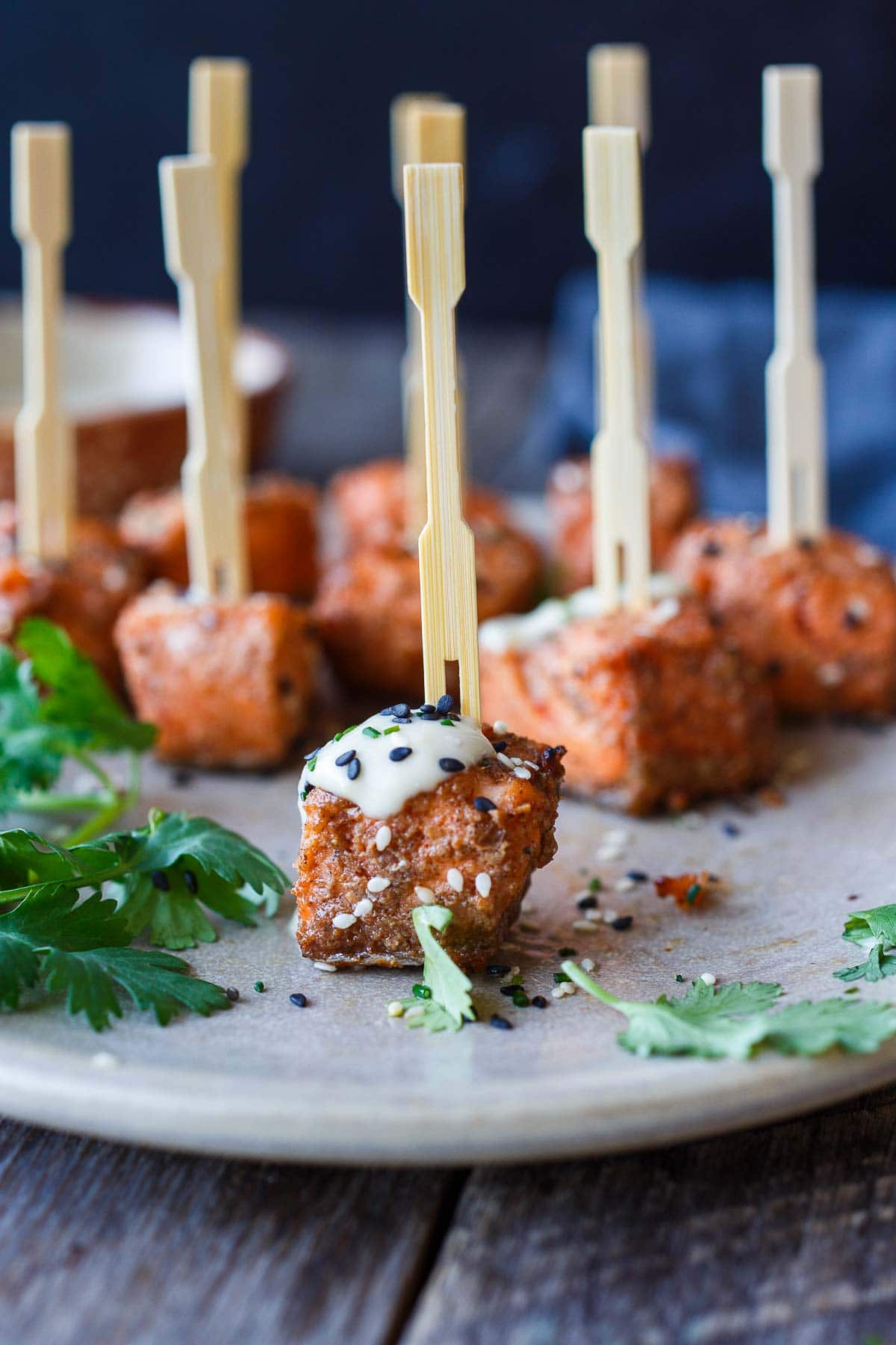 Succulent and flavorful, Air Fryer Salmon Bites are served with a miso ginger dipping sauce and ready in about 15 minutes! Perfect for appetizers, bowls, salads, and snacks! Gluten-free.